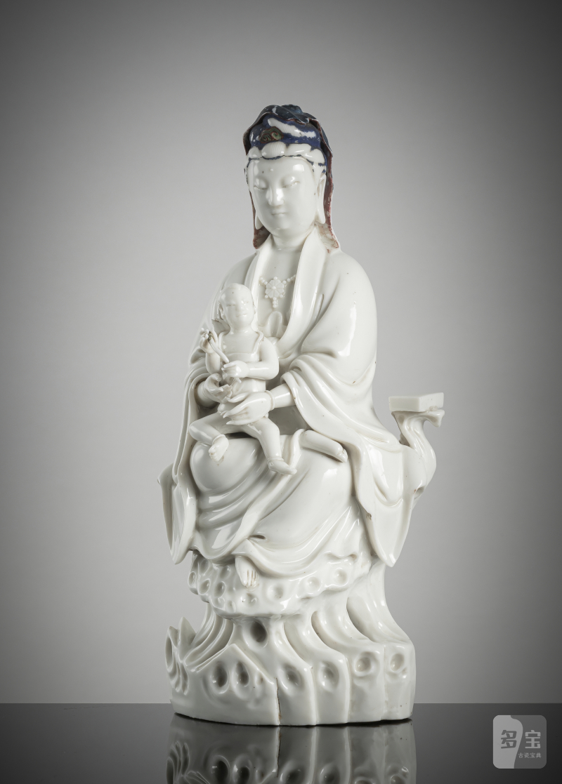 A dehua figure of a Guanyin and child